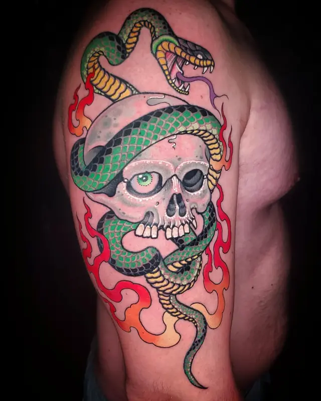 Snake and skull with flames by Chris Carp at Heart & Sword Tattoo