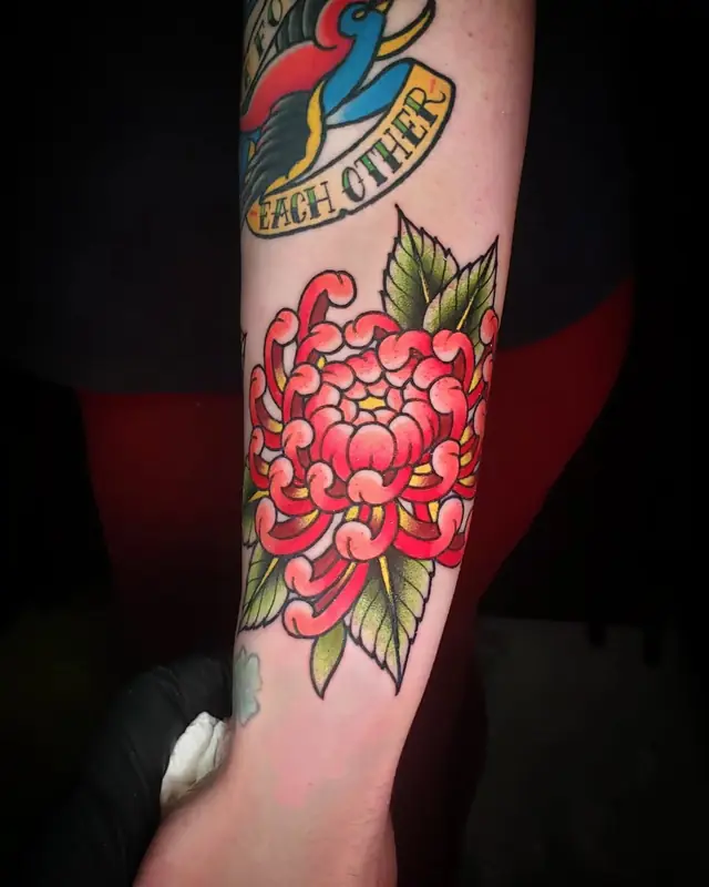 Color chrysanthemum with swallow by Chris Carp at Heart & Sword Tattoo