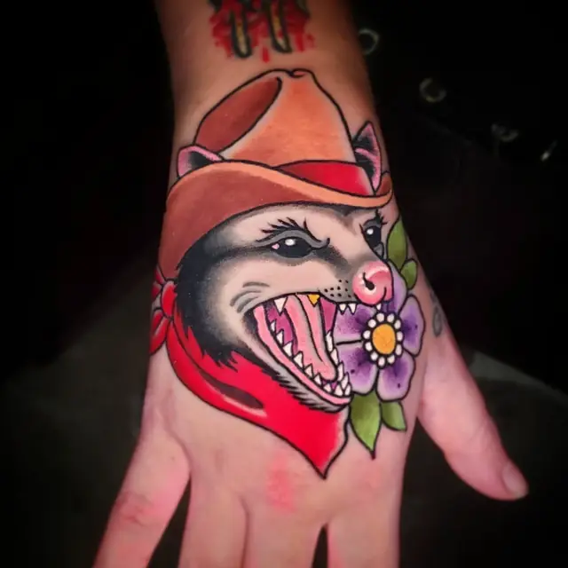 Possum in a cowboy hat hand tattoo by Chris Carp at Heart & Sword Tattoo