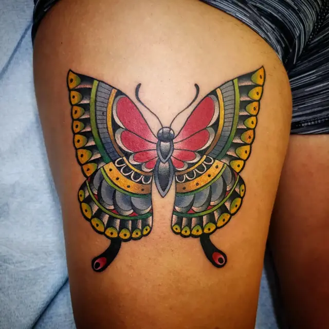 Traditional color butterfly by Chris Carp at Heart & Sword Tattoo