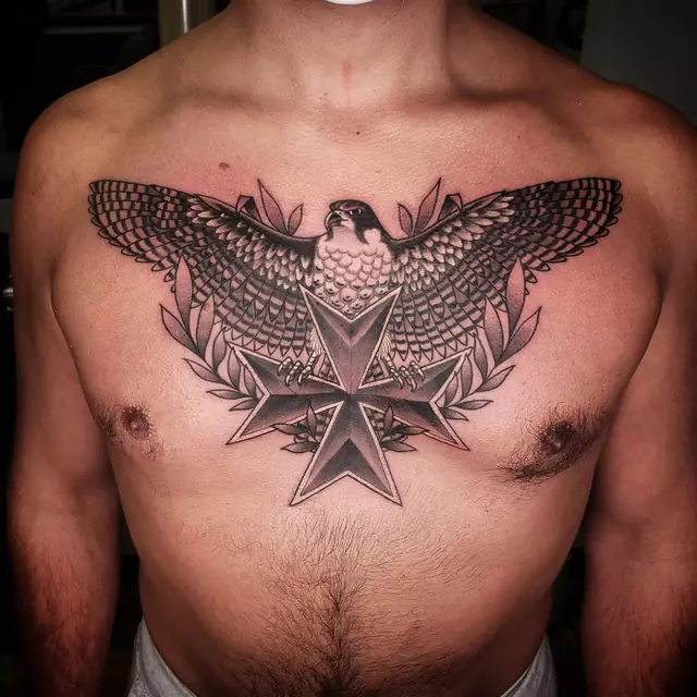 Black and gray falcon and cross chest piece by Chris Carp at Heart & Sword Tattoo