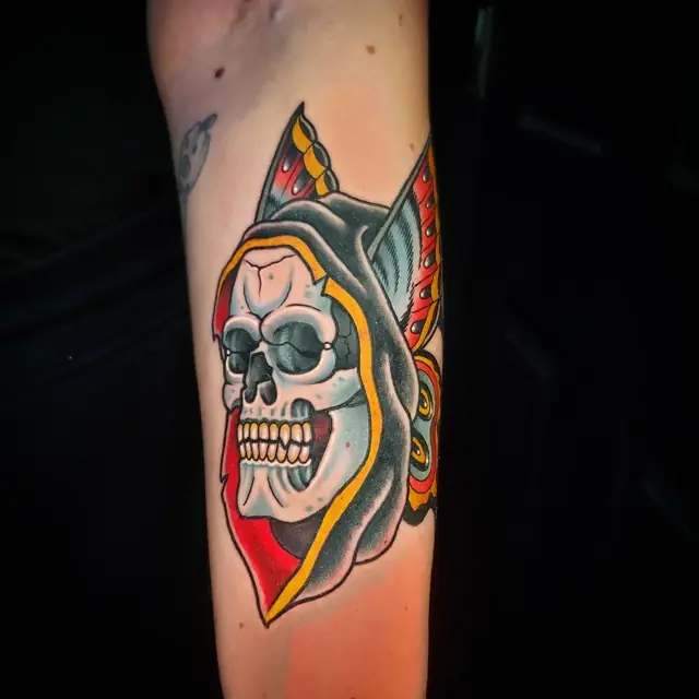 Traditional color hooded skull by Chris Carp at Heart & Sword Tattoo
