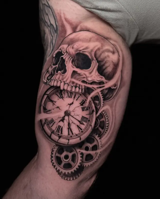 Black and gray skull with pocket watch and gears by Dina at Heart & Sword Tattoo