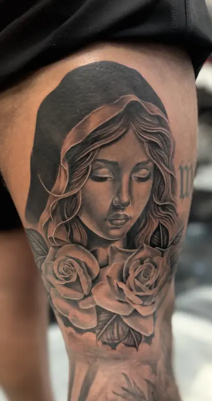 Black and gray woman portrait with roses by Johnny at Heart & Sword Tattoo