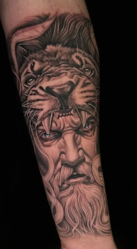 Black and gray realism lion and bearded god forearm by Johnny at Heart & Sword Tattoo